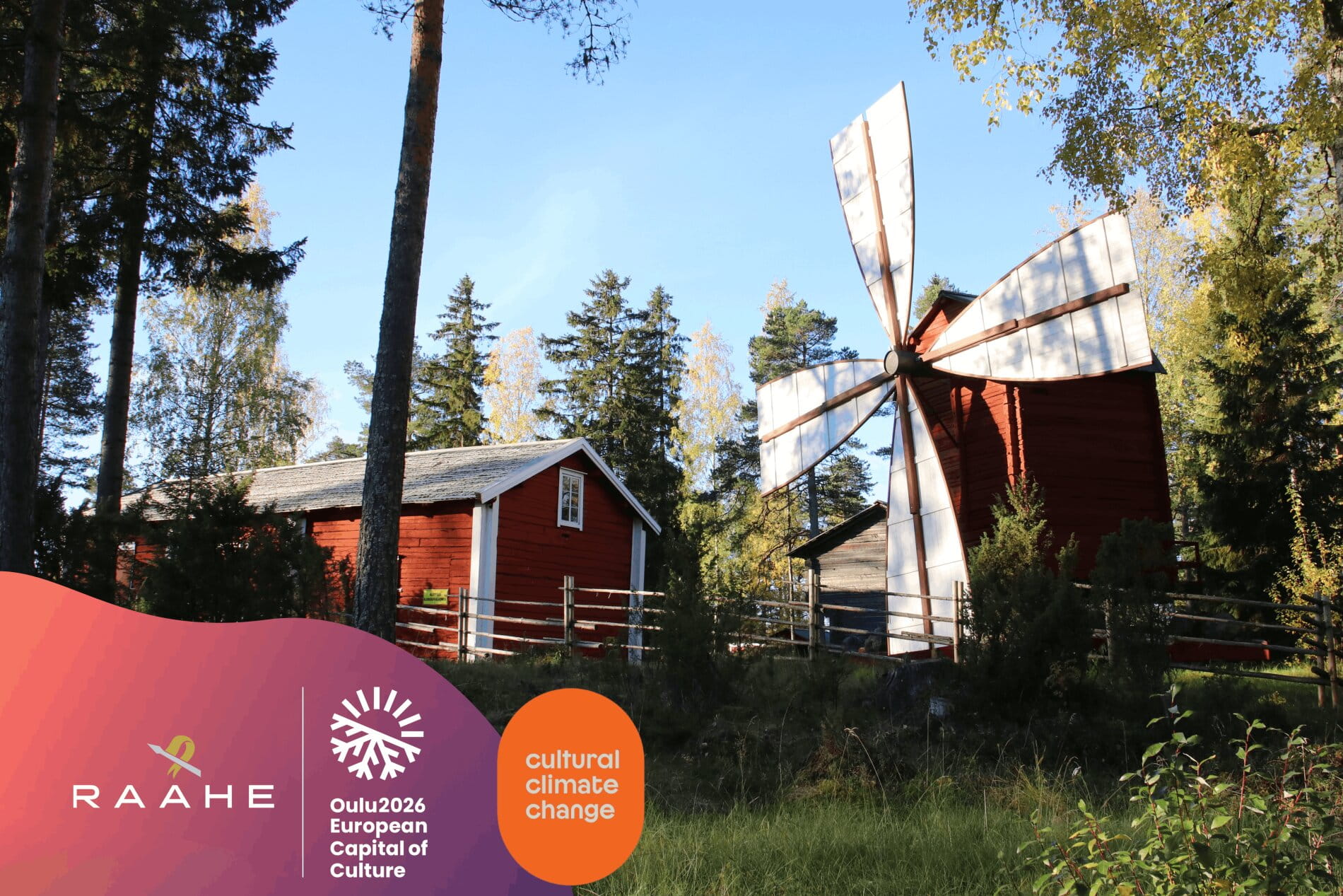 The surroundings of the Saloisten Local Heritage Museum: a red wooden building and an old windmill.
