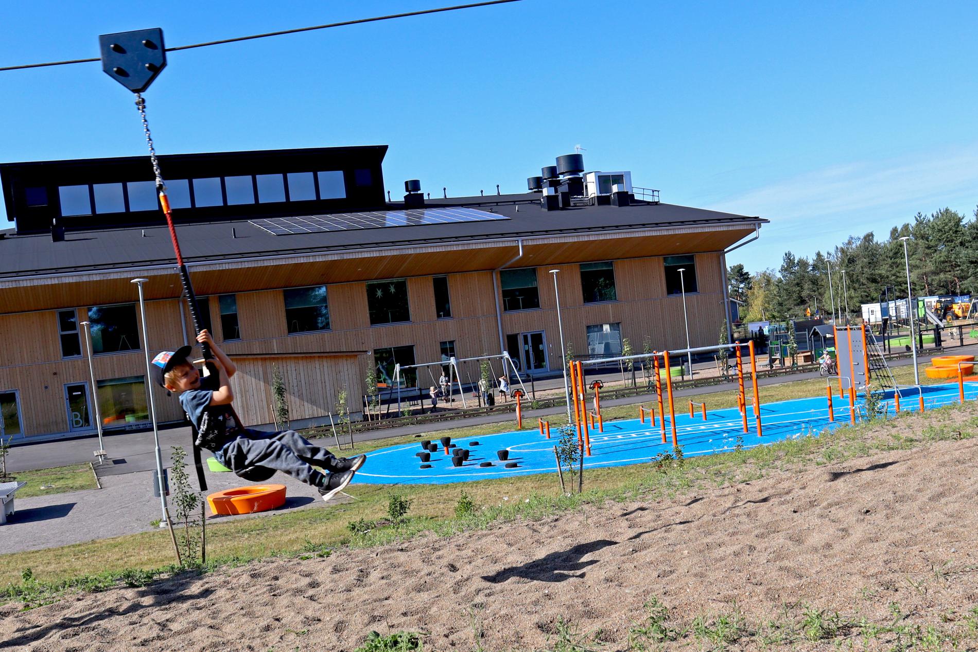 Ziplining in front of the Saloinen school centre.