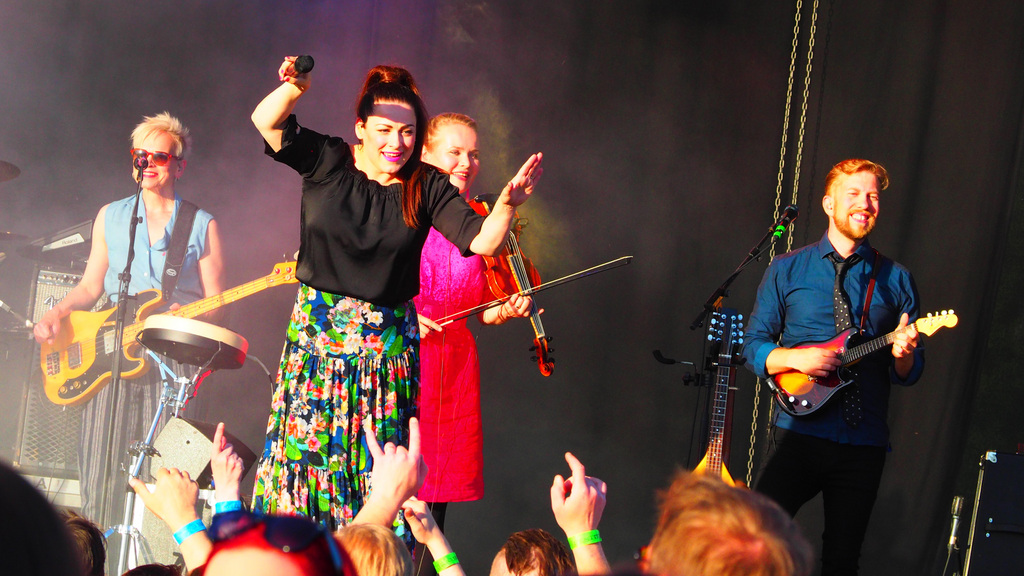 Singer Erin on stage with her band.